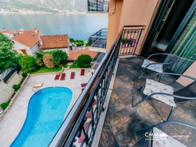 Two-bedroom apartment in complex with a swimming pool in Dobrota