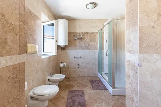 Spacious duplex apartment with sea view in Sveti Stefan — photo 27